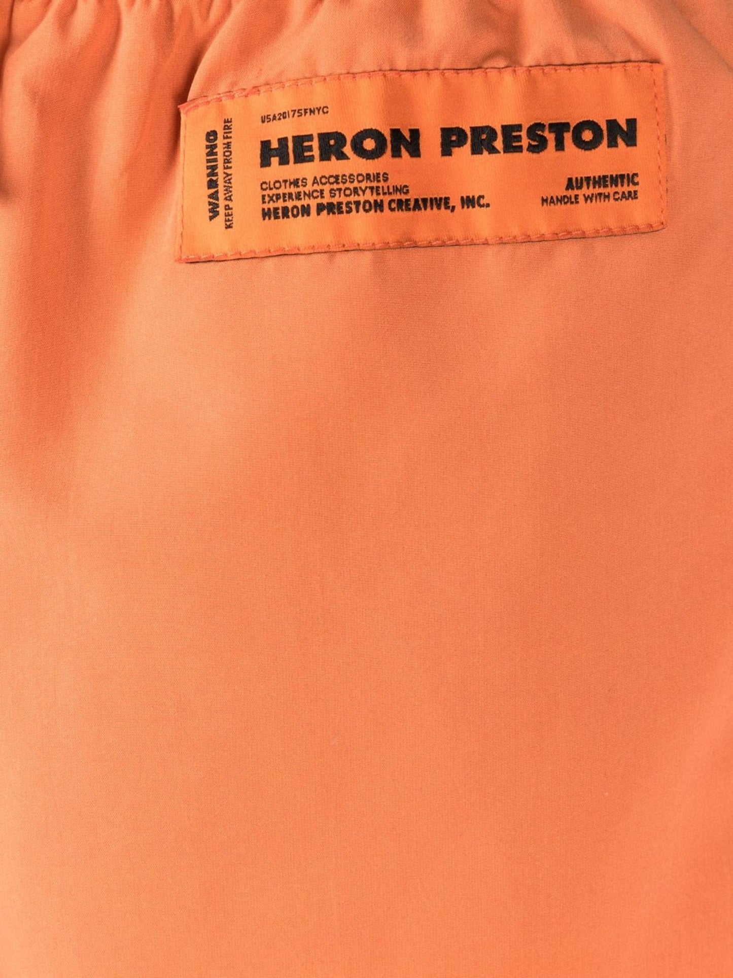 logo patch swim shorts by heron preston - bottegalusso: premier destination for modern luxury menswear