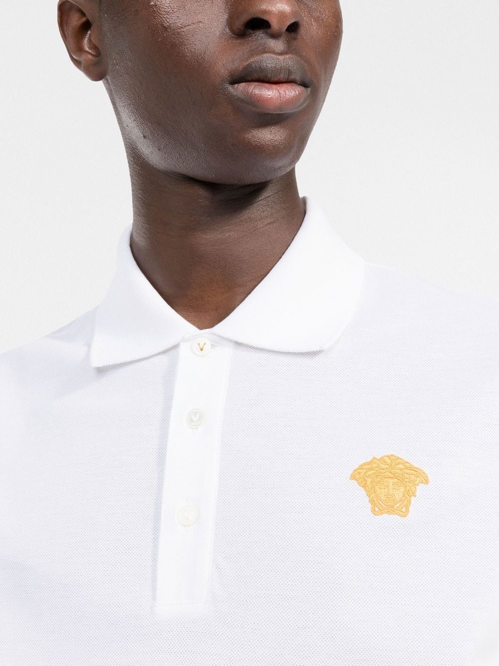 medusa head motif polo shirt by versace - bottegalusso: premier destination for modern luxury menswear