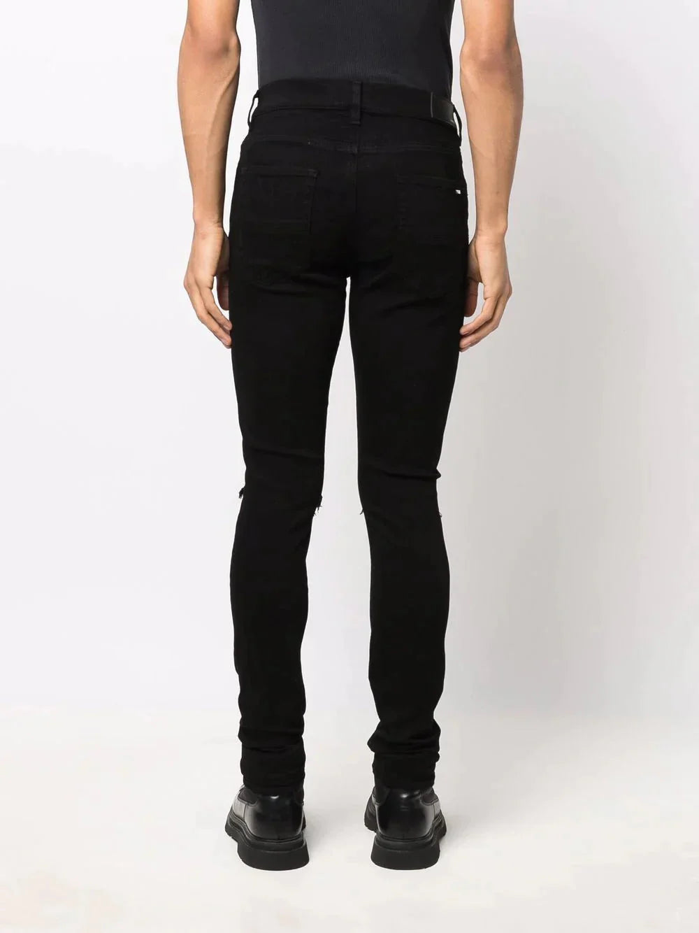 ripped detailing skinny jeans by amiri - bottegalusso: premier destination for modern luxury menswear