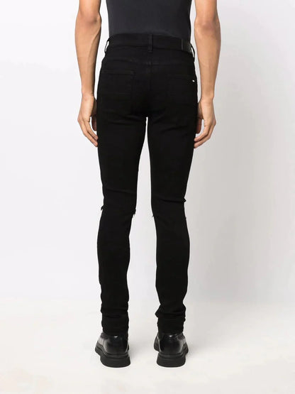 Ripped Detailing Skinny Jeans by Amiri - bottegalusso: Premier Destination for Modern Luxury Menswear