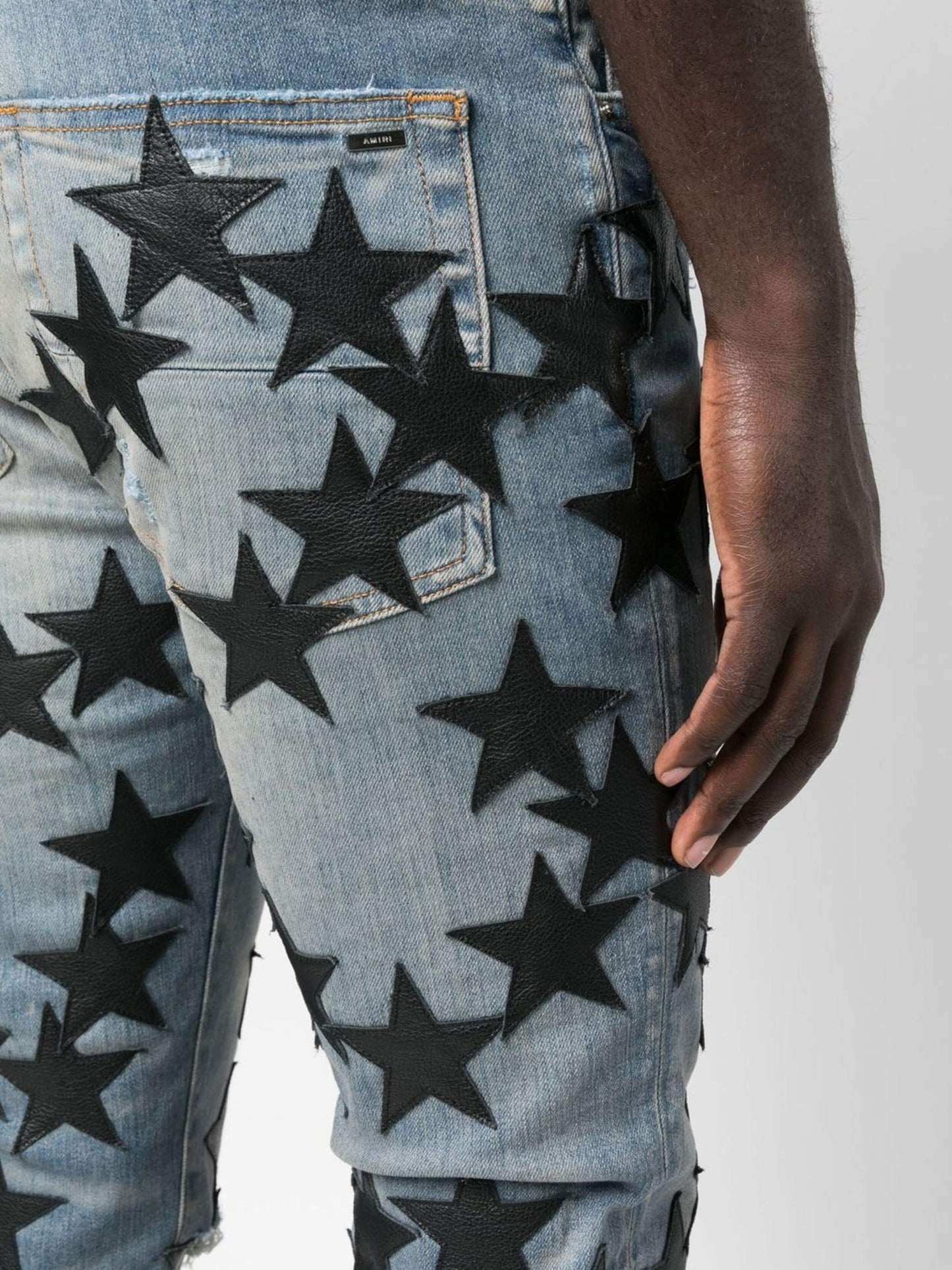 star patch skinny jeans by amiri - bottegalusso: premier destination for modern luxury menswear